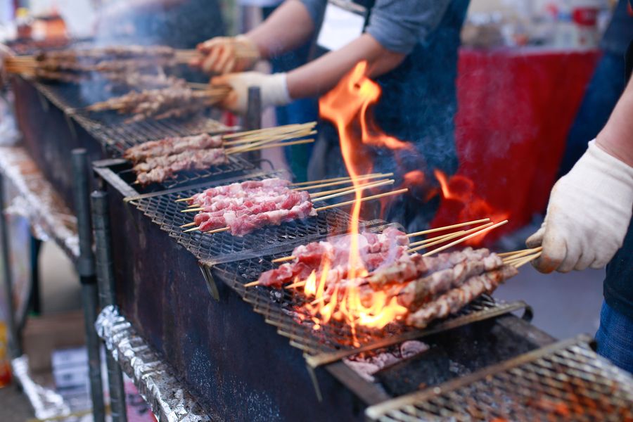 Skewers grilling at a food vendor